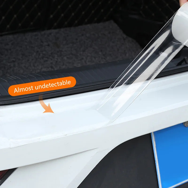 Clear protective film being applied to a car window with 'Almost undetectable' text.