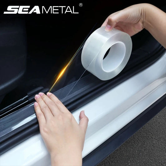 Person applying clear tape to a car window with 'SEAMETAL' branding.