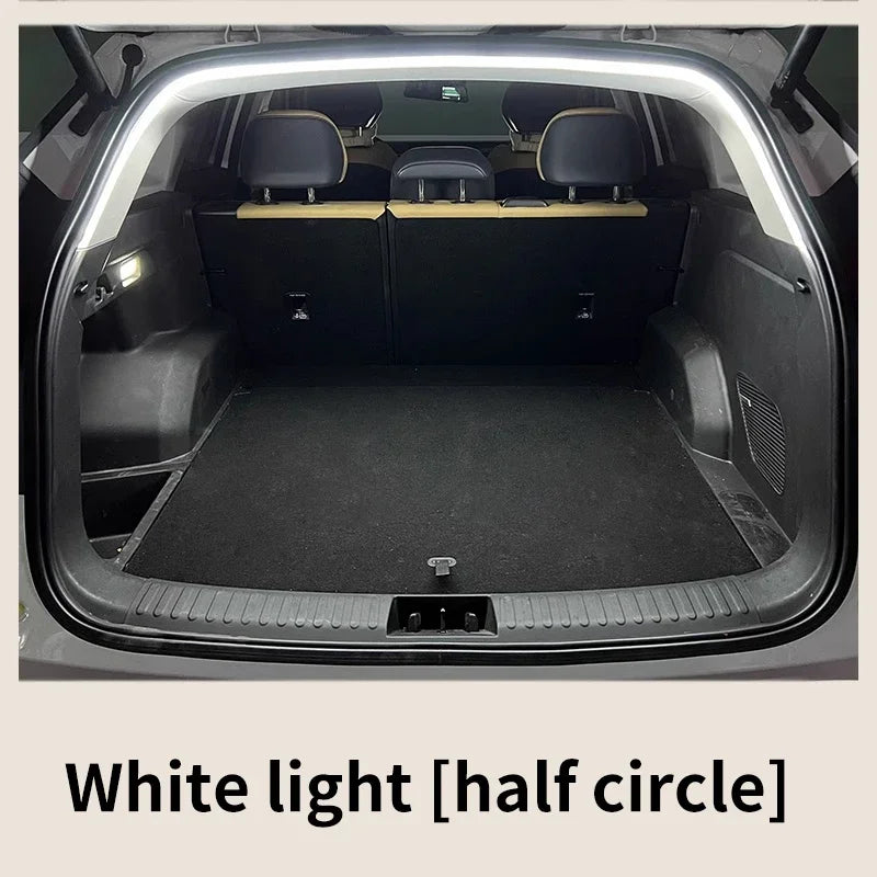 Car trunk with white light strip at the top, text 'White light [half circle]' below.